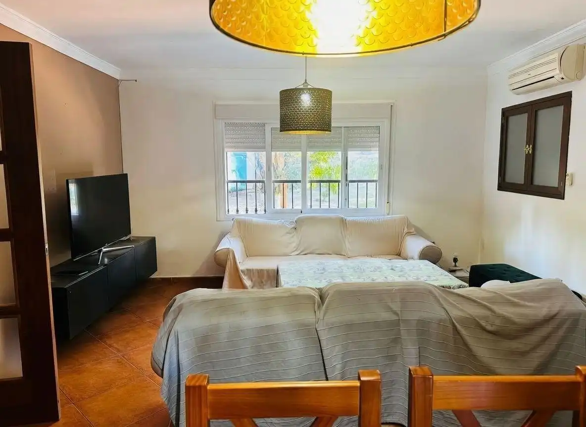 Sala de estar de Casa adosada en venta en Campo de Mijas