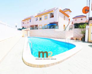 Swimming pool of Single-family semi-detached for sale in Guardamar del Segura  with Air Conditioner and Terrace