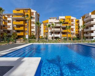 Swimming pool of Apartment for sale in Torrevieja  with Air Conditioner, Heating and Parquet flooring