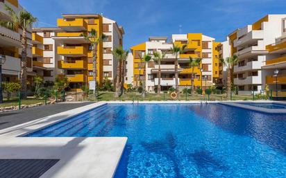 Swimming pool of Apartment for sale in Torrevieja  with Air Conditioner, Heating and Parquet flooring