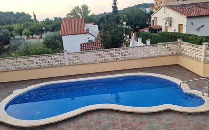 Piscina de Casa adosada en venda en La Pobla de Montornès   amb Calefacció, Jardí privat i Terrassa