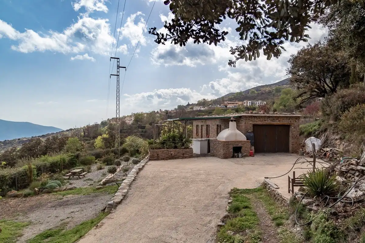 Vista exterior de Casa o xalet en venda en Pórtugos amb Calefacció, Jardí privat i Terrassa