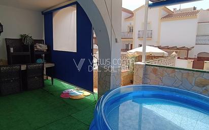 Swimming pool of Single-family semi-detached for sale in Nerja  with Air Conditioner, Heating and Terrace