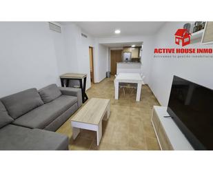 Sala d'estar de Apartament de lloguer en Alcanar amb Aire condicionat, Terrassa i Piscina