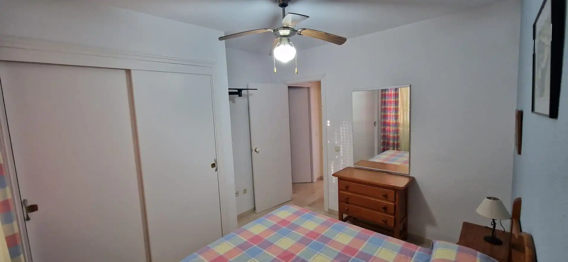Dormitori de Apartament de lloguer en El Portil amb Piscina comunitària