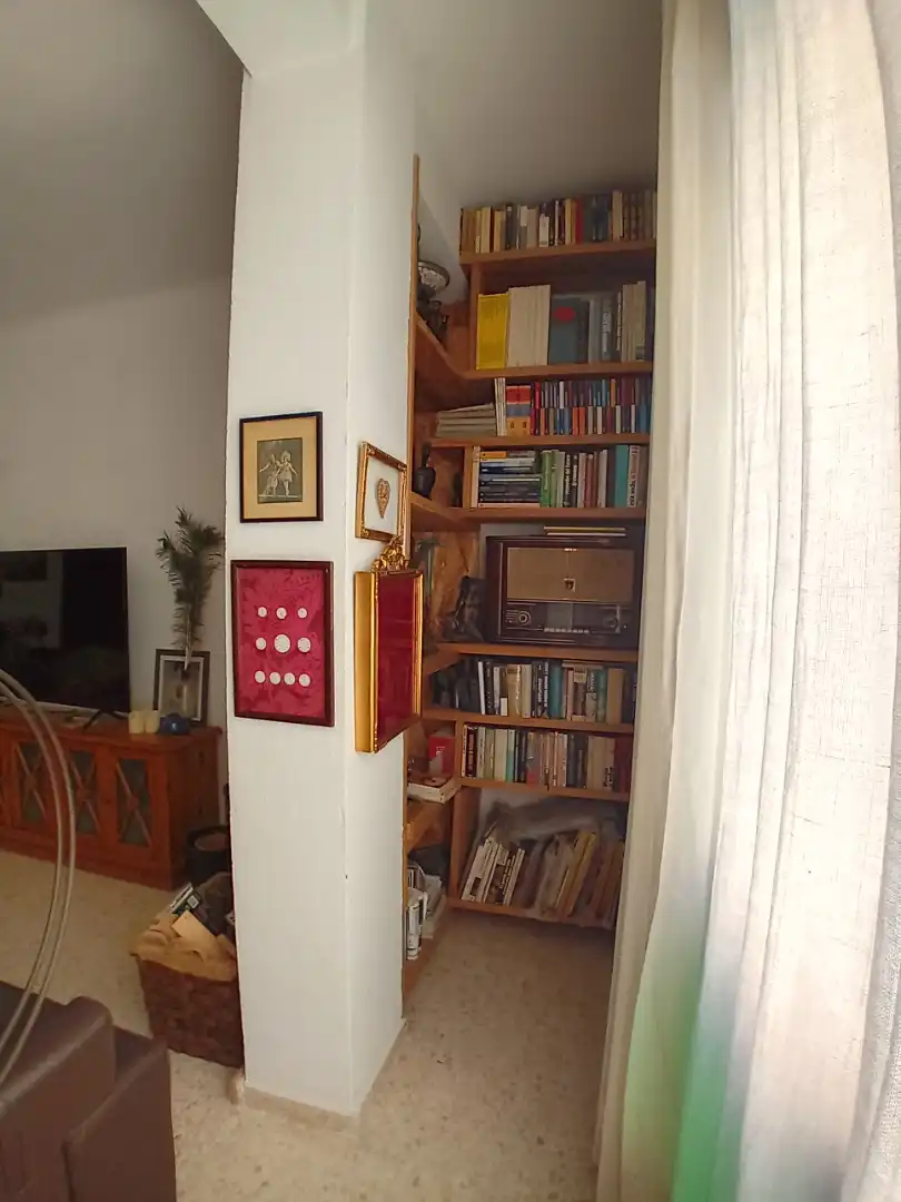 Sala d'estar de Casa adosada en venda en Málaga amb Piscina