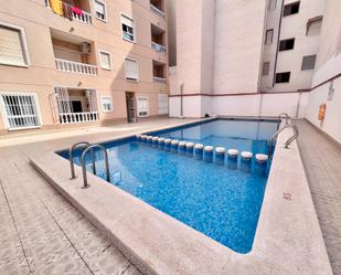 Swimming pool of Flat for sale in Torrevieja  with Air Conditioner, Heating and Terrace