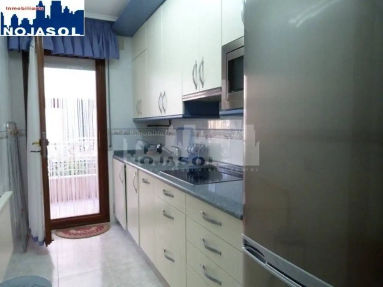 Cuina de Apartament de lloguer en Noja amb Calefacció, Jardí privat i Terrassa