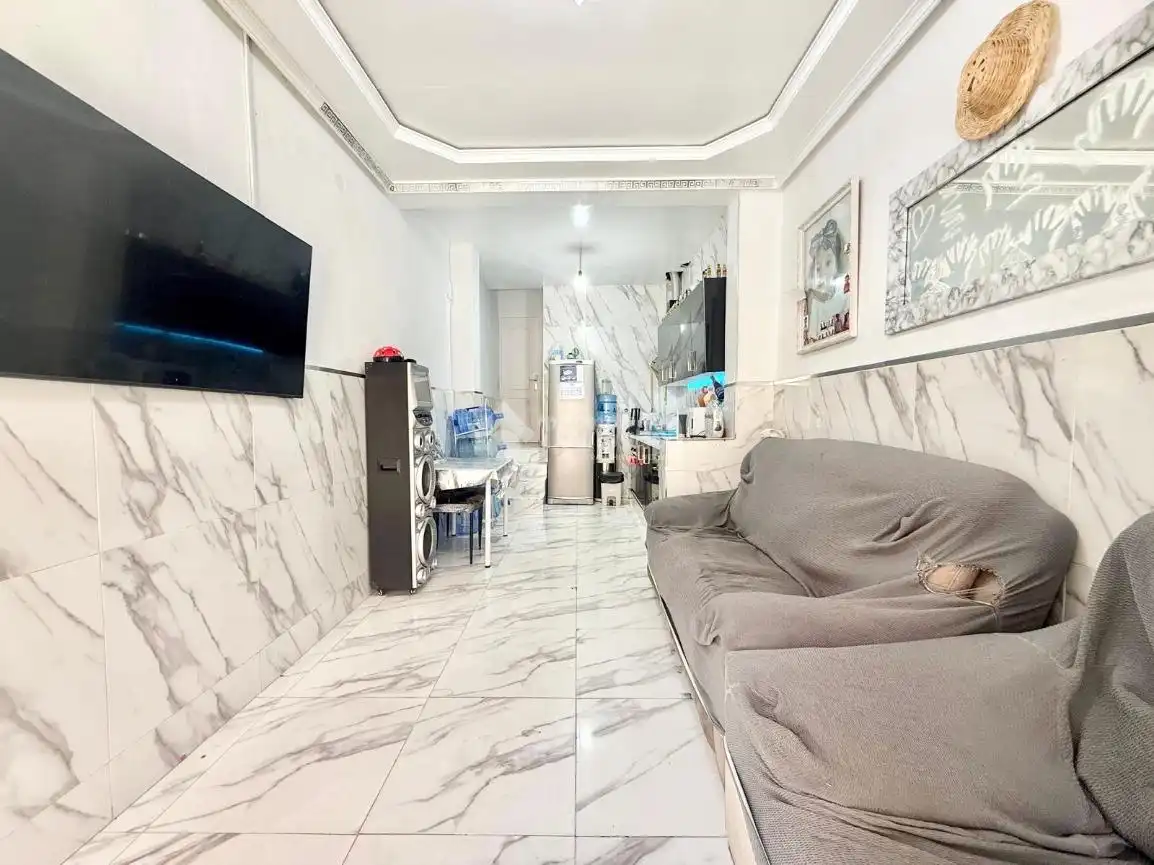 Sala d'estar de Casa adosada en venda en Almería amb Terrassa i Balcó