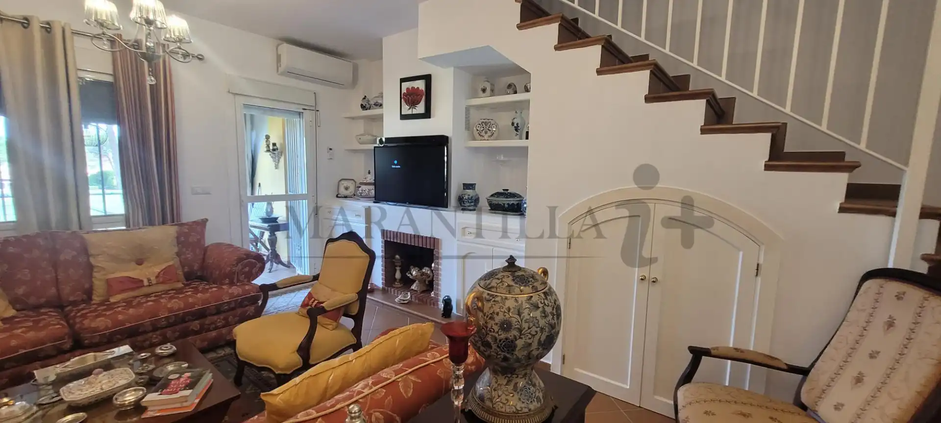 Sala de estar de Casa adosada en venta en Islantilla con Aire acondicionado, Calefacción y Jardín privado