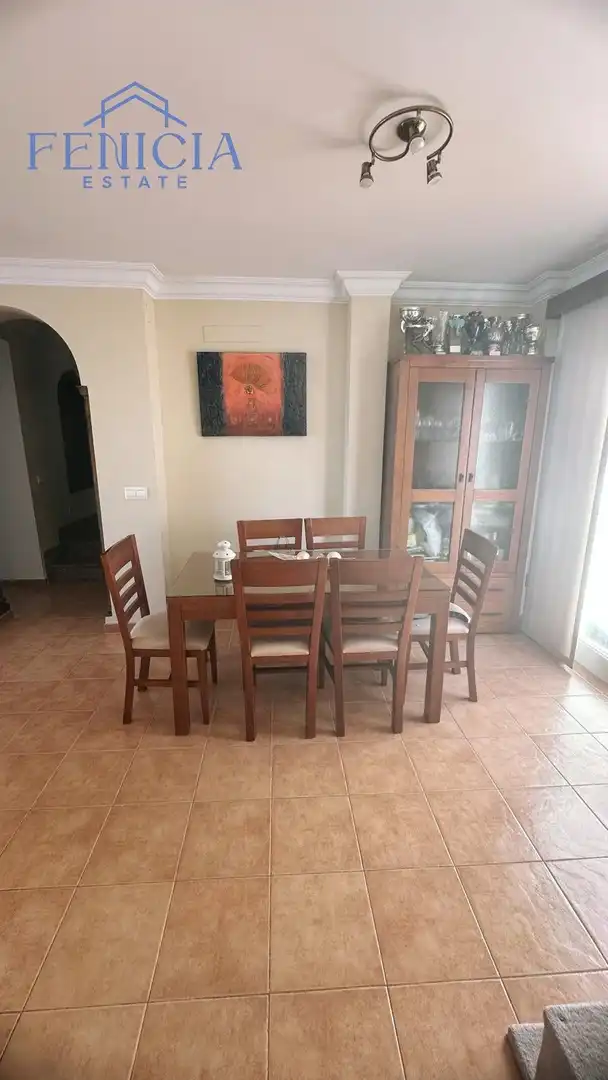Comedor de Casa adosada en venta en Nerja con Jardín privado, Terraza y Piscina comunitaria