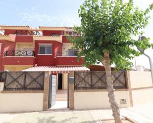 Exterior view of Single-family semi-detached for sale in Pilar de la Horadada  with Air Conditioner, Terrace and Swimming Pool