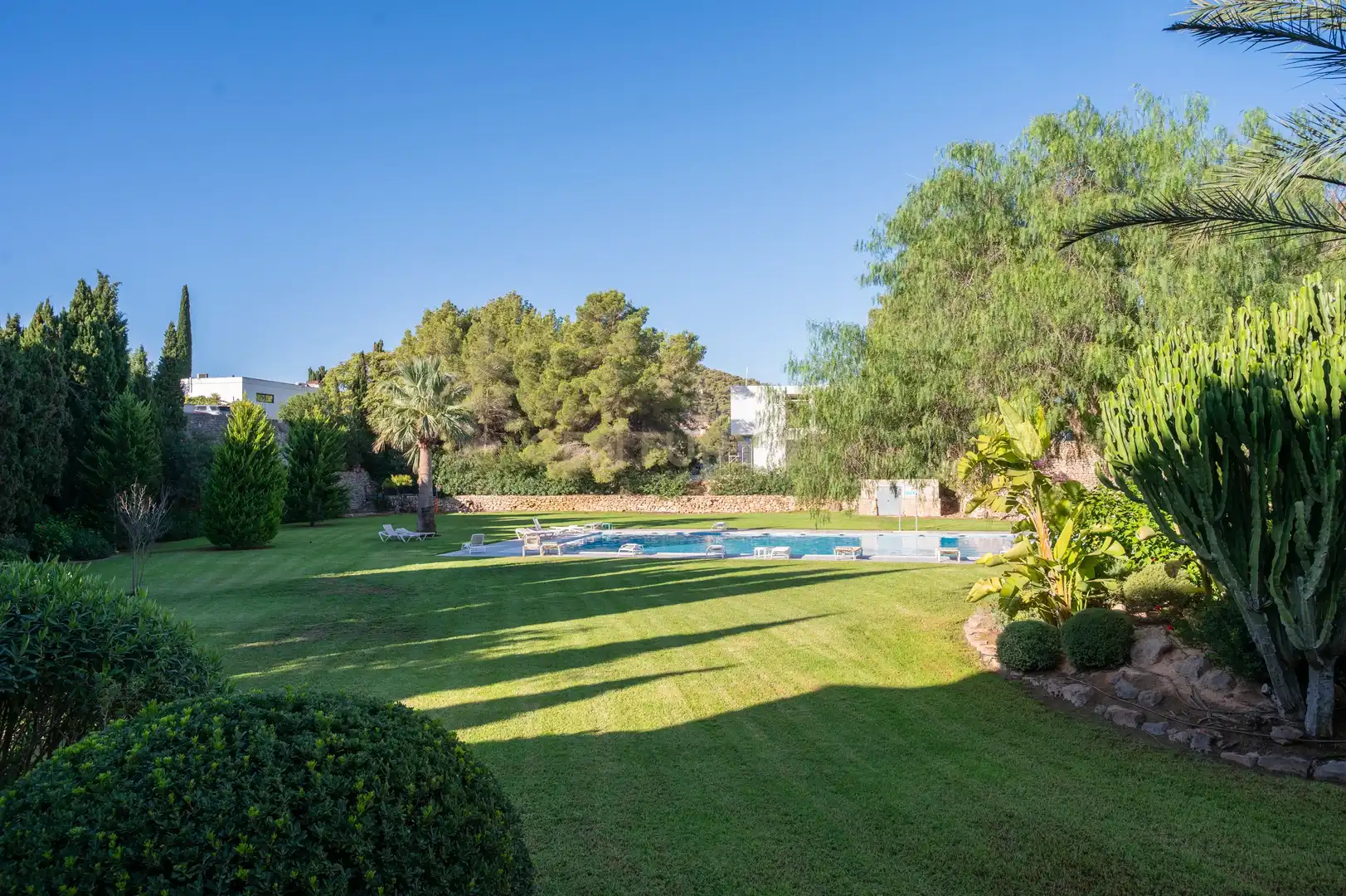 Jardín de Apartamento de alquiler en Santa Eulària des Riu con Aire acondicionado, Jardín privado y Piscina comunitaria