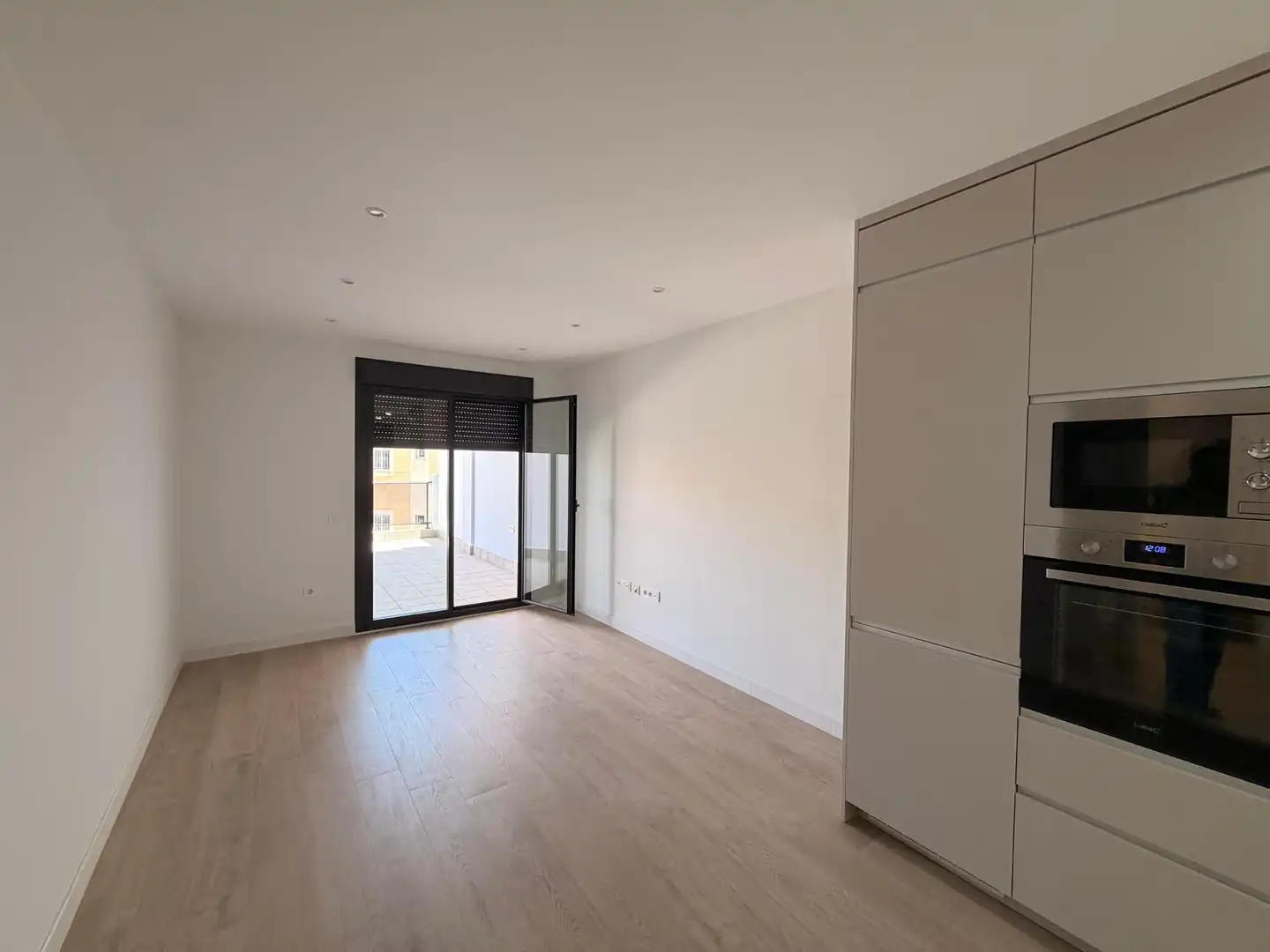 Sala d'estar de Pis de lloguer en Huércal de Almería amb Aire condicionat, Jardí privat i Terrassa