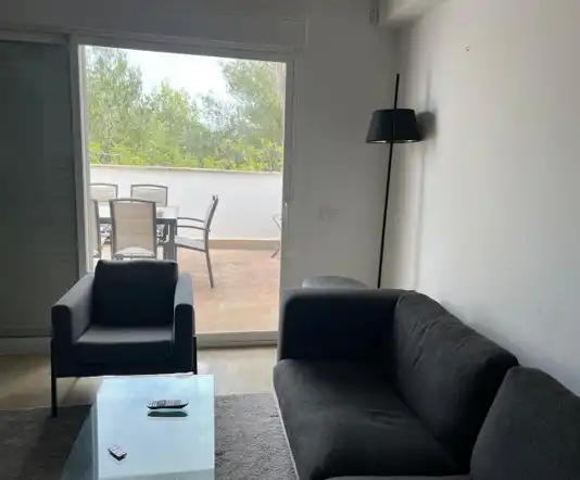 Wohnzimmer von Einfamilien-Reihenhaus zum Verkauf in Santa Eulària des Riu mit Klimaanlage, Terrasse und Möbliert