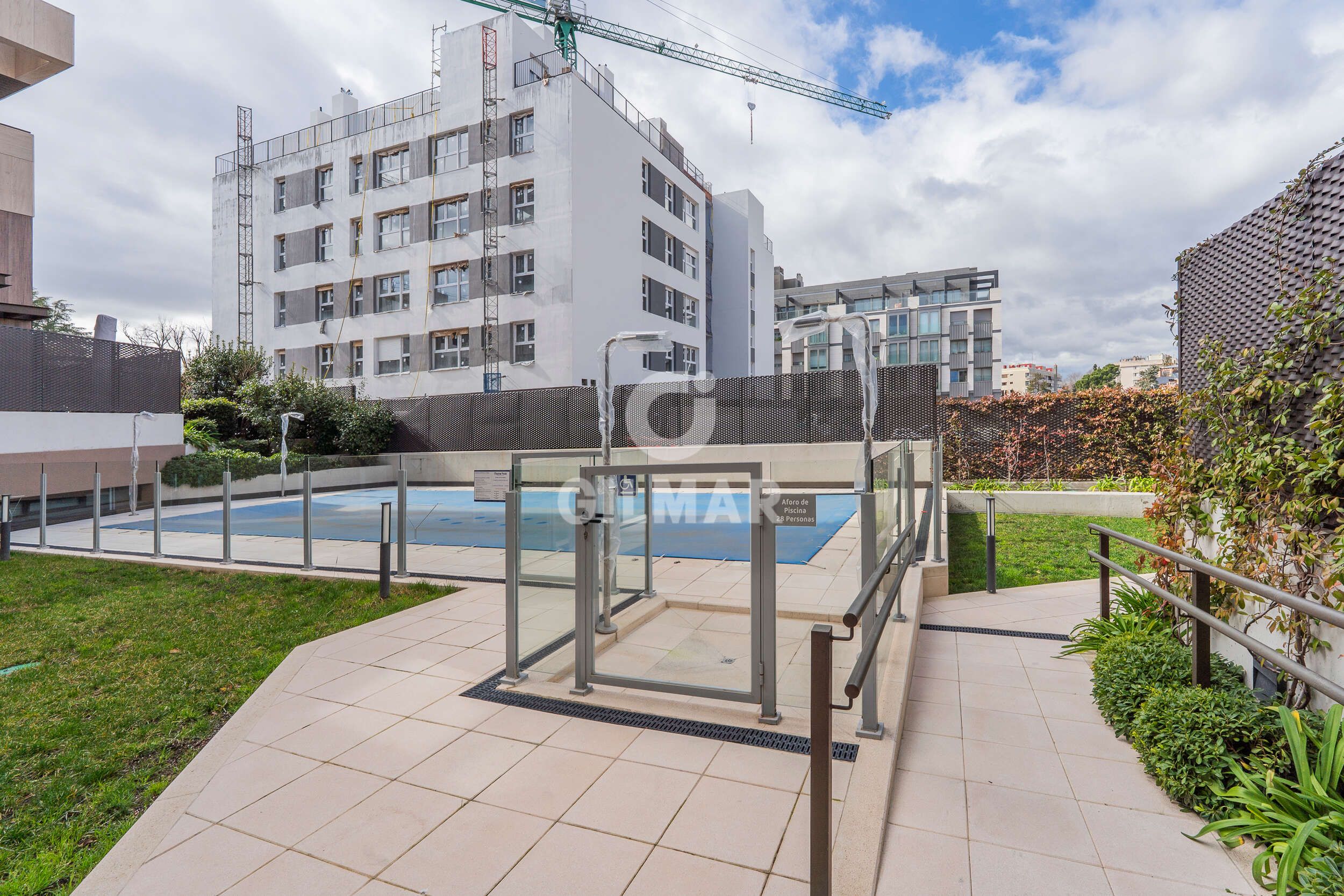 Swimming pool of Attic for sale in  Madrid Capital  with Heating, Private garden and Storage room