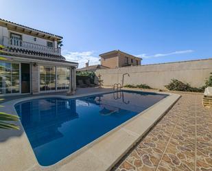 Swimming pool of Single-family semi-detached for sale in Torrevieja  with Air Conditioner, Heating and Private garden