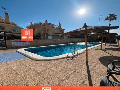 Swimming pool of Single-family semi-detached for sale in Orihuela  with Air Conditioner, Private garden and Terrace