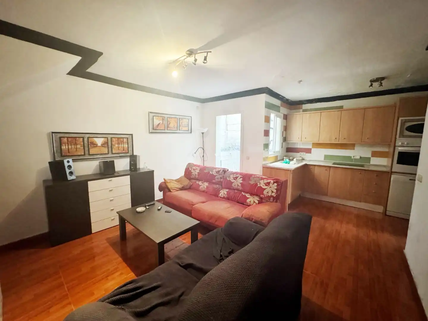 Sala d'estar de Casa adosada en venda en Manilva amb Aire condicionat, Terrassa i Moblat