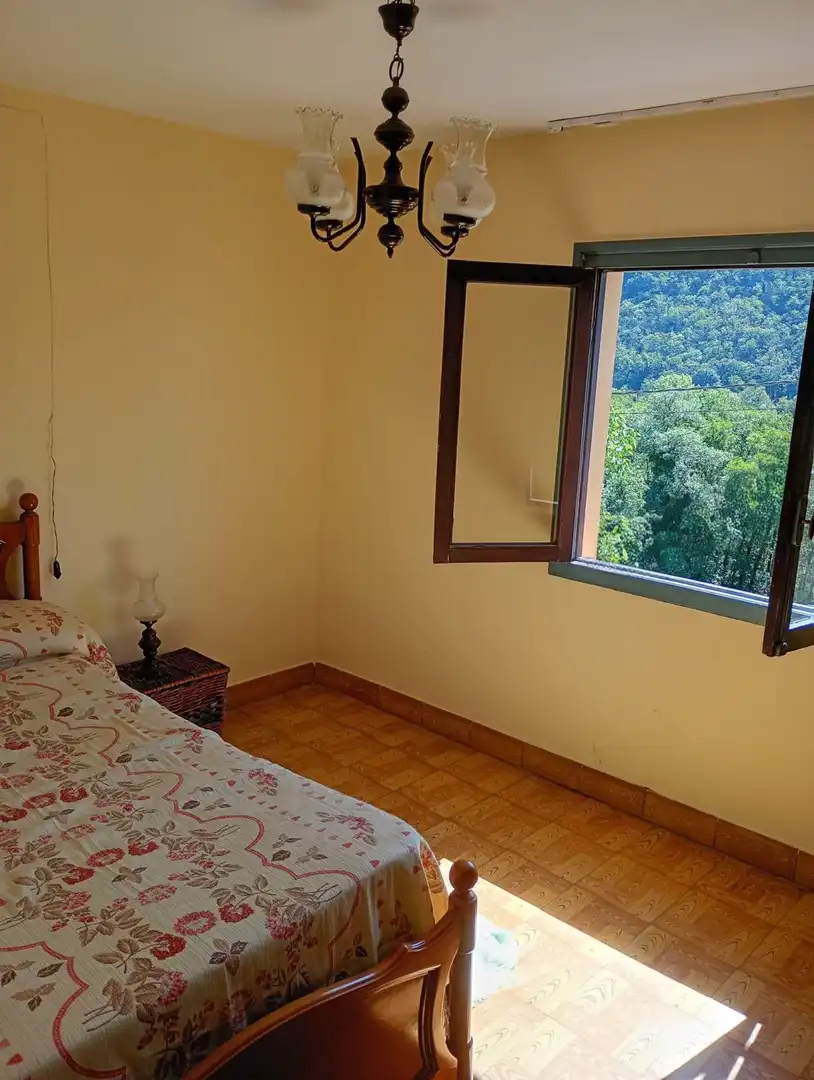 Habitación de Casa adosada en venta en Pravia con Calefacción, Terraza y Trastero
