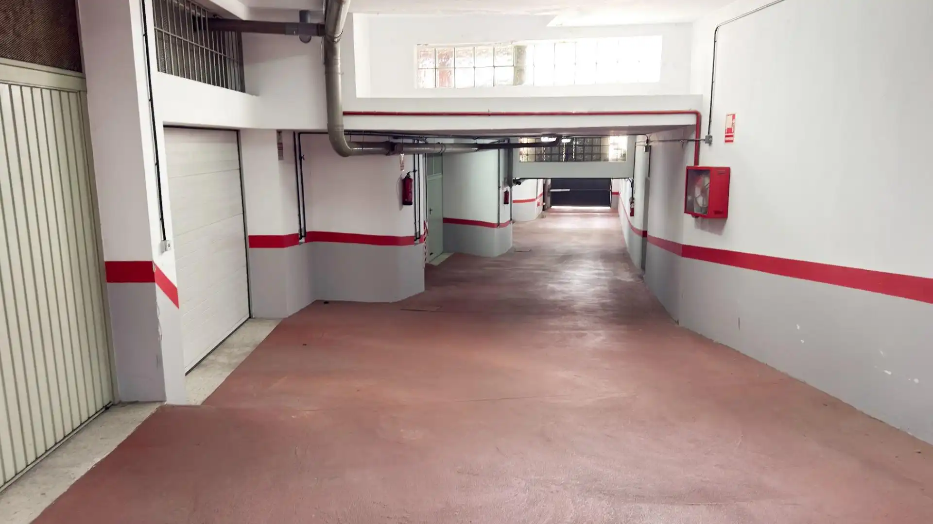Parking de Casa adosada de alquiler en Punta Umbría con Terraza y Piscina comunitaria