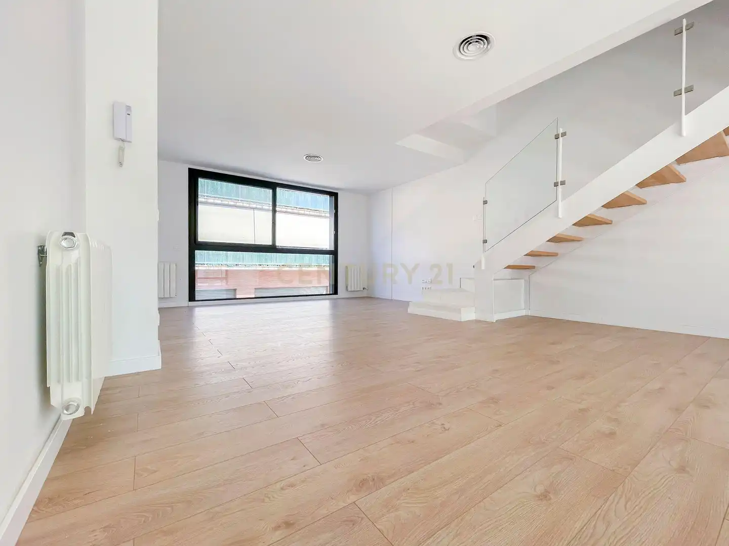 Sala d'estar de Casa adosada en venda en Hostalric