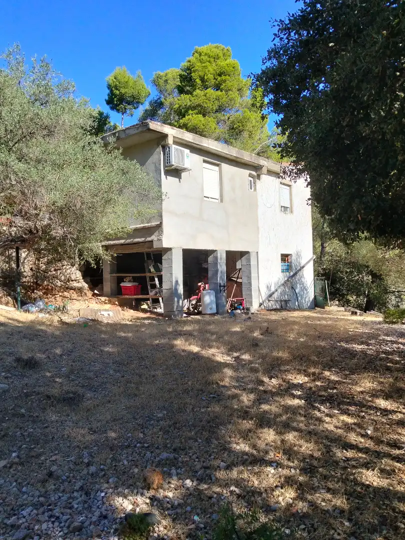 Casa rústica amb jardí en venda a Puigpunyent