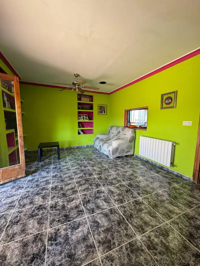 Sala d'estar de Casa adosada en venda en Alcañiz amb Terrassa, Traster i Piscina comunitària