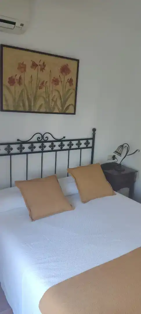 Dormitori de Casa adosada de lloguer en Islantilla amb Aire condicionat, Piscina i Balcó