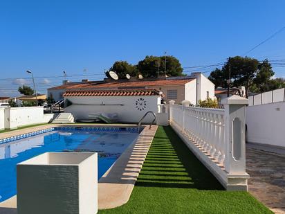 Swimming pool of House or chalet for sale in Torrevieja  with Air Conditioner, Heating and Parquet flooring