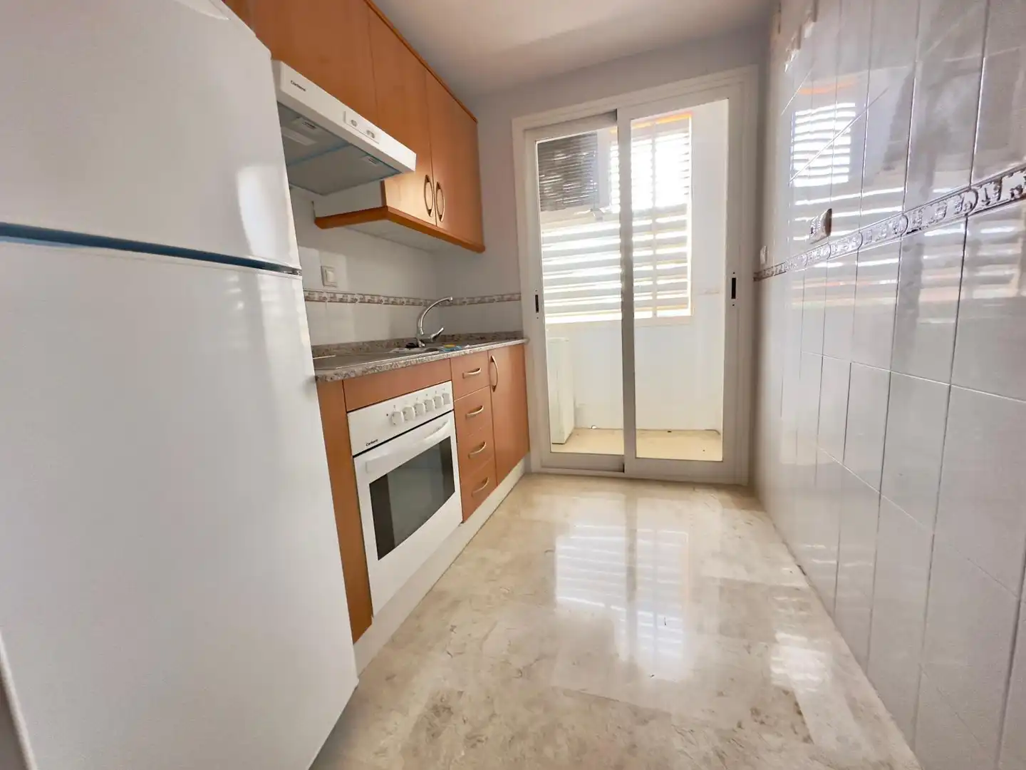 Cuina de Apartament en venda en Benidorm amb Jardí privat, Terrassa i Piscina comunitària