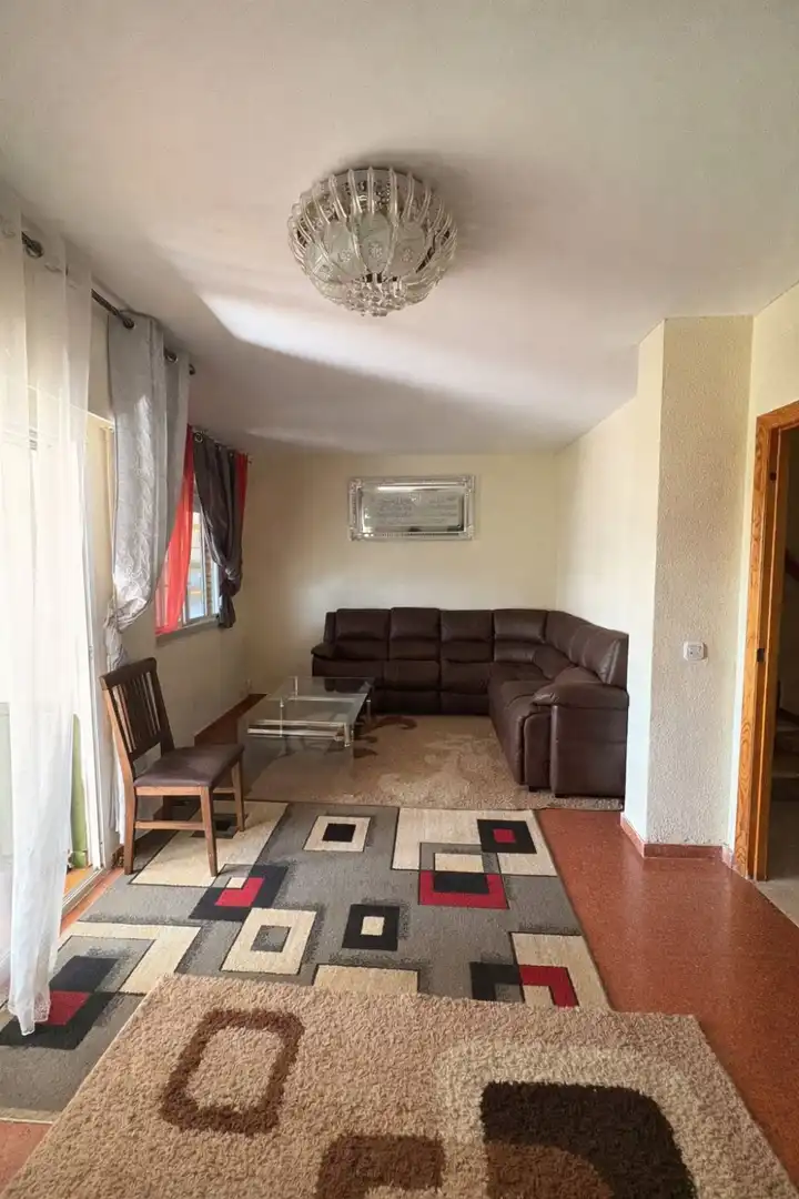 Sala de estar de Casa adosada en venta en Manzanares con Aire acondicionado, Jardín privado y Terraza