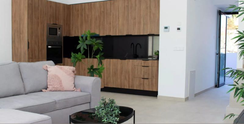 Sala d'estar de Casa adosada en venda en Calpe / Calp amb Aire condicionat, Calefacció i Jardí privat