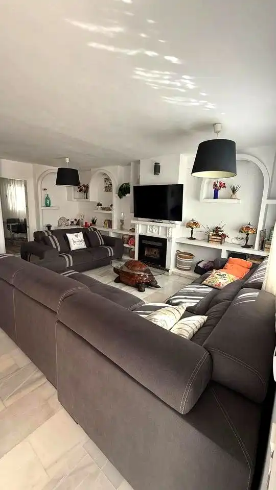 Sala de estar de Casa adosada en venta en Málaga con Aire acondicionado y Piscina comunitaria
