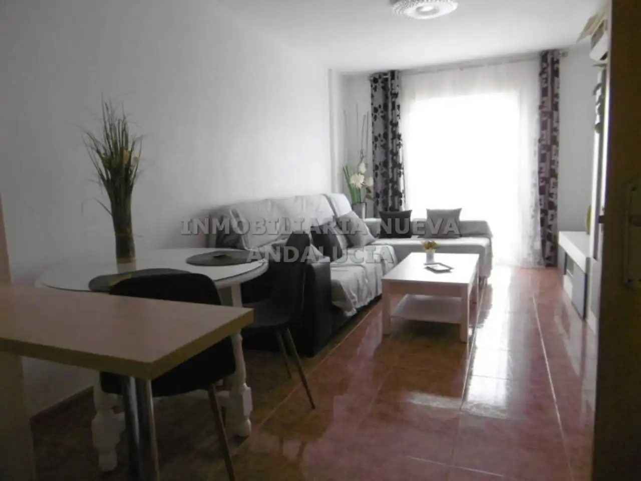 Sala d'estar de Pis de lloguer en Almería amb Aire condicionat i Moblat
