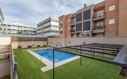 Swimming pool of Flat for sale in  Granada Capital  with Air Conditioner, Heating and Private garden