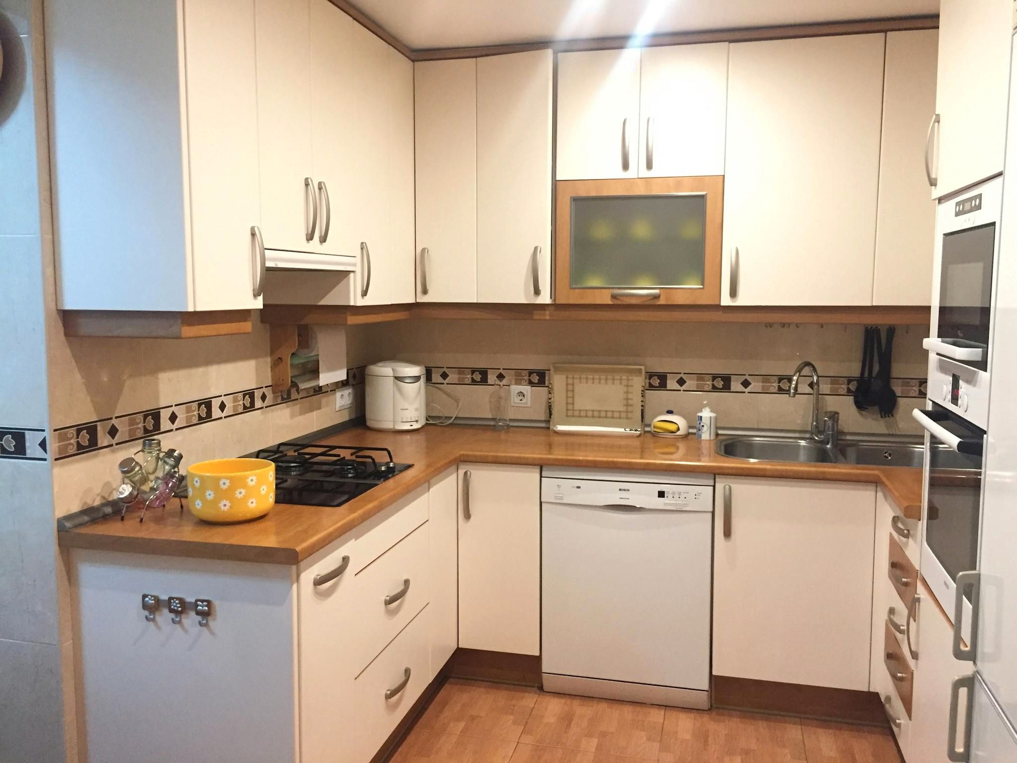 Kitchen of Flat to share in  Madrid Capital  with TV and Balcony