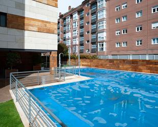 Swimming pool of Flat for sale in  Madrid Capital  with Air Conditioner, Private garden and Storage room