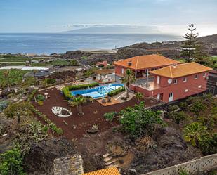 Vista exterior de Casa o xalet en venda en Santiago del Teide amb Aire condicionat, Calefacció i Piscina