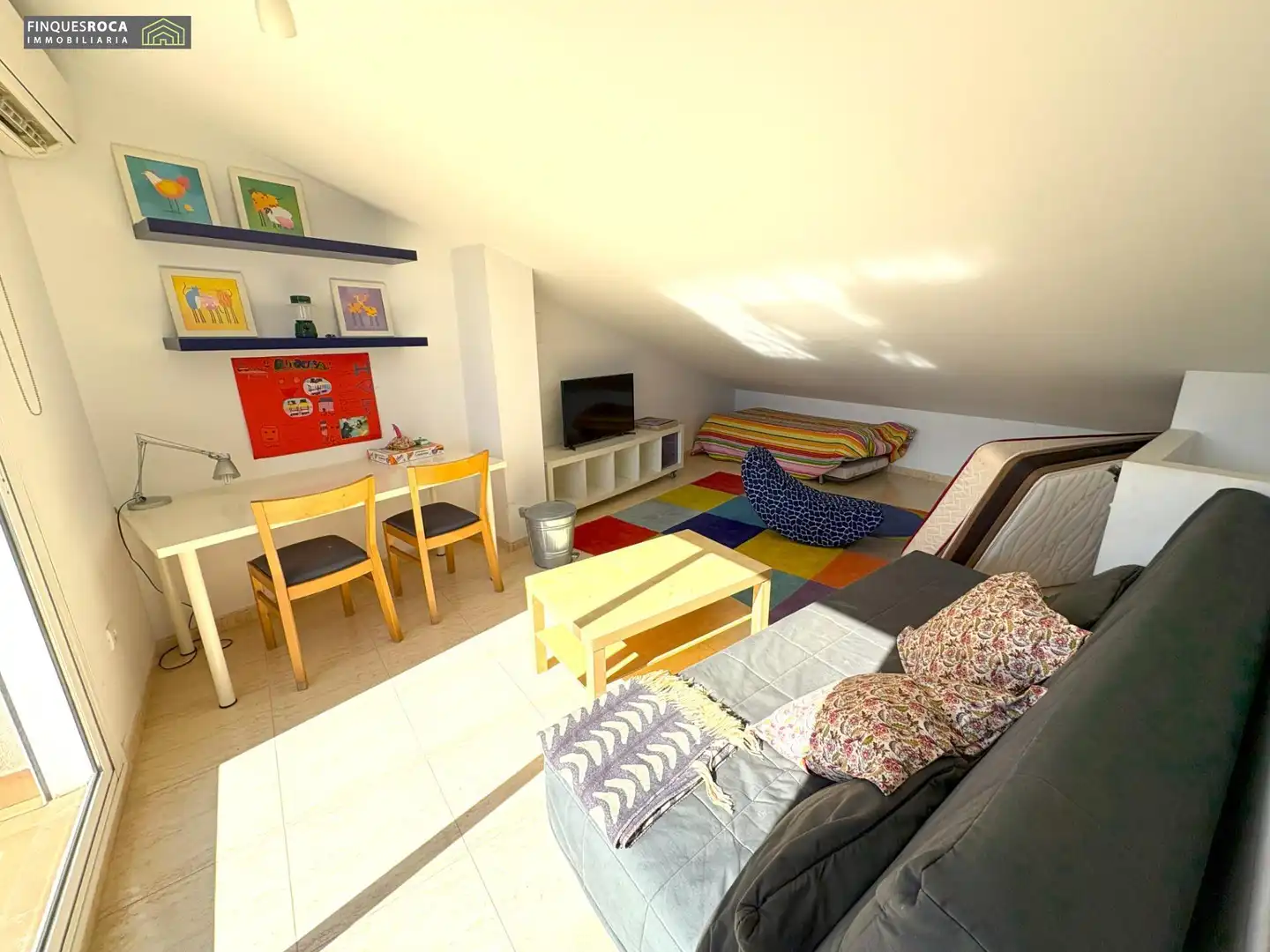 Sala d'estar de Casa adosada en venda en La Ràpita amb Aire condicionat, Jardí privat i Terrassa