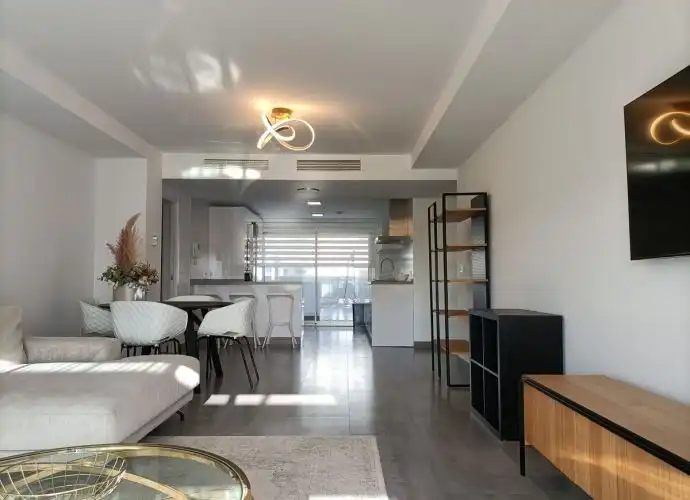 Living room of Flat for sale in Estepona  with Air Conditioner, Terrace and Storage room