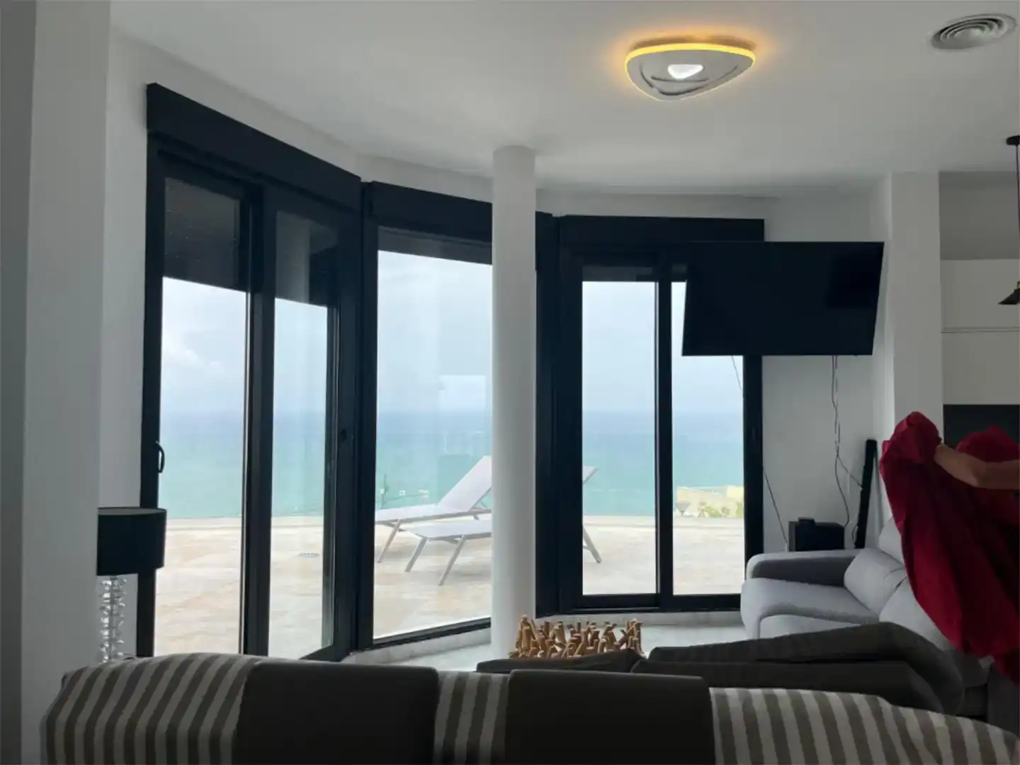 Sala d'estar de Casa adosada de lloguer en Cullera amb Aire condicionat, Piscina i Balcó