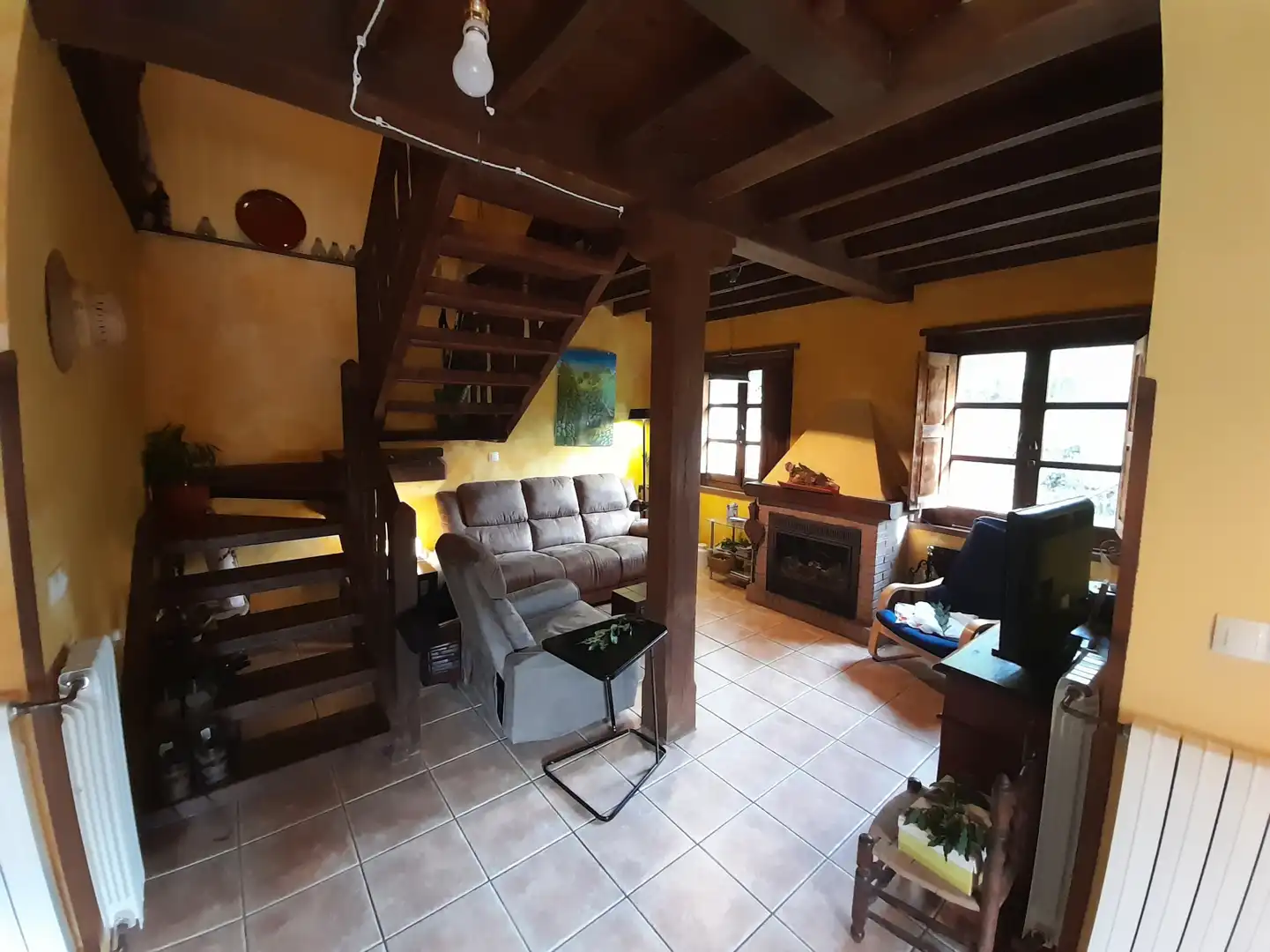 Sala d'estar de Casa adosada en venda en Caso amb Calefacció, Terrassa i Traster
