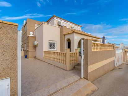 Exterior view of Single-family semi-detached for sale in Torrevieja  with Private garden, Furnished and Community pool