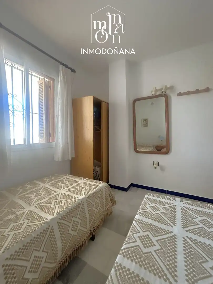Habitación de Casa adosada en venta en Almonte con Terraza, Piscina y Amueblado