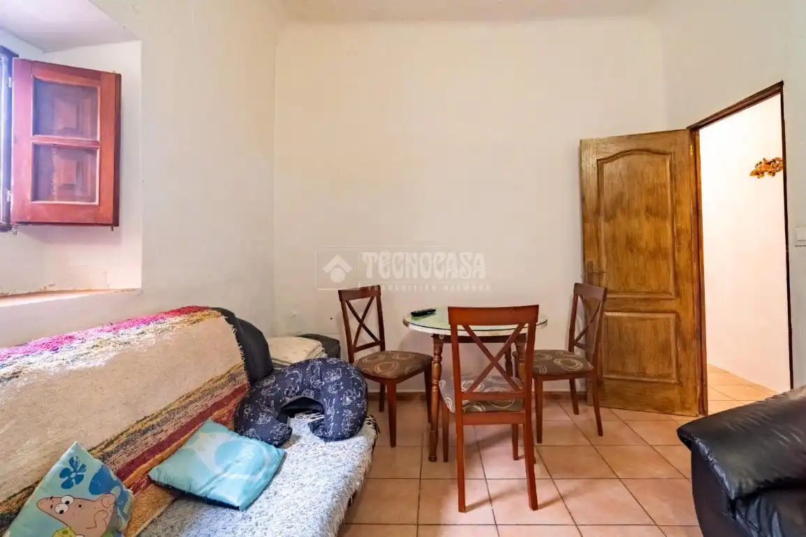 Sala d'estar de Casa adosada en venda en Órgiva amb Aire condicionat, Terrassa i Moblat