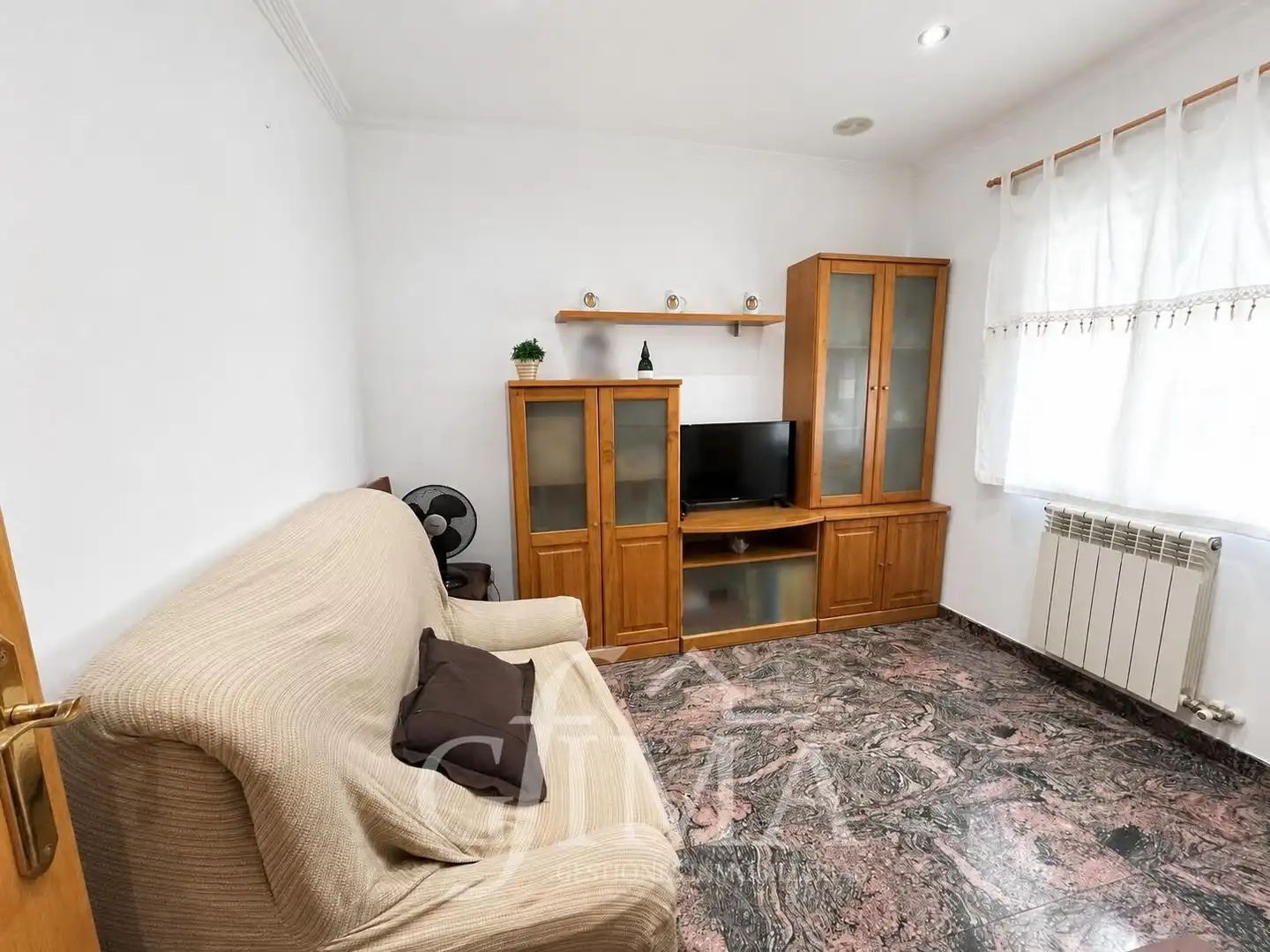 Sala de estar de Casa adosada en venta en Tomelloso con Calefacción, Trastero y Amueblado