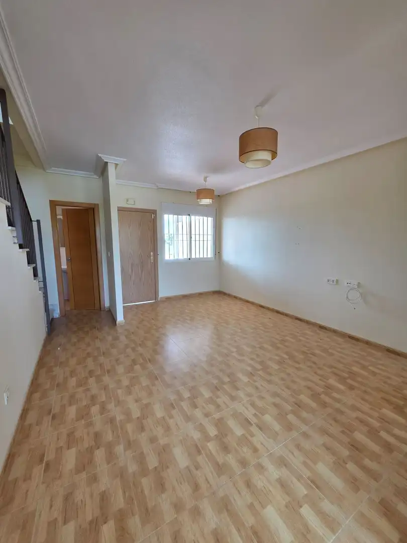 Sala d'estar de Casa adosada en venda en Rojales amb Terrassa, Traster i Piscina comunitària