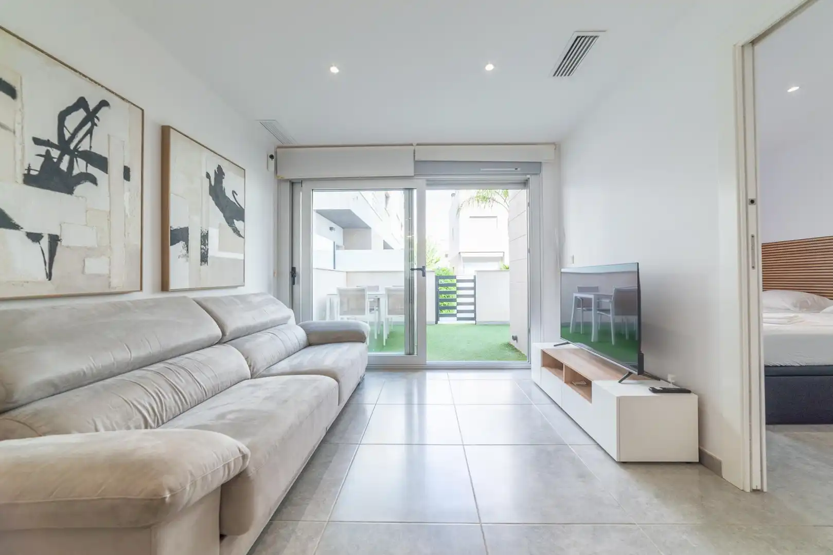 Sala d'estar de Casa adosada en venda en San Javier amb Aire condicionat, Jardí privat i Terrassa