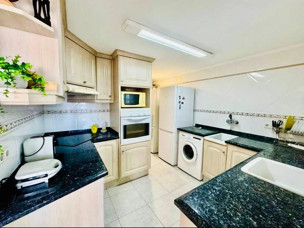 Kitchen of Flat for sale in Sueca  with Air Conditioner, Private garden and Storage room